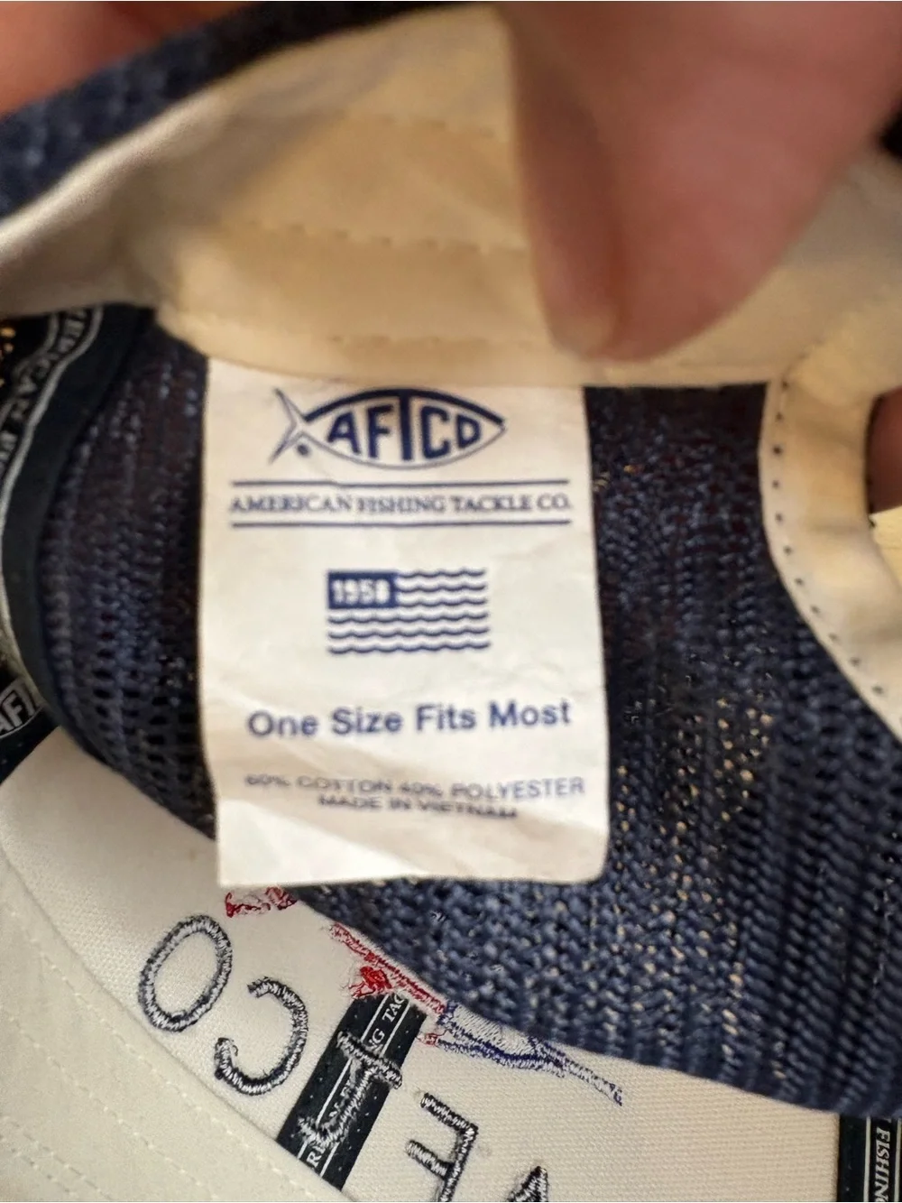 AFTCO Meric trucker hat with an embroidered American flag billfish graphic. NWT